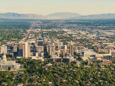 An aerial view of Salt Lake City, UT showing the urban areas and urban canopy