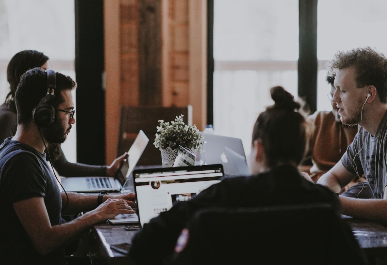 Photo: Work colleagues at desk (Source: Unsplash) Work colleagues at desk