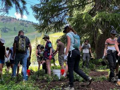 Volunteers hiking at alta ski resort