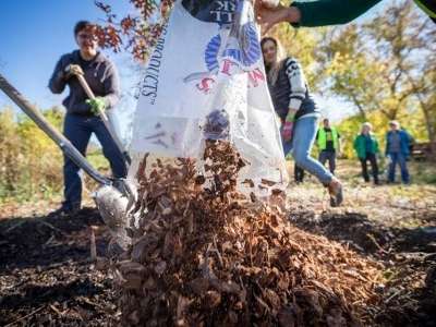 bag of mulching being dumped on the ground